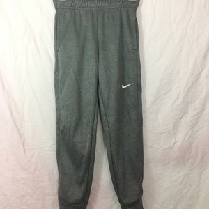 Gray Nike sweatpants with cuffed ankle
